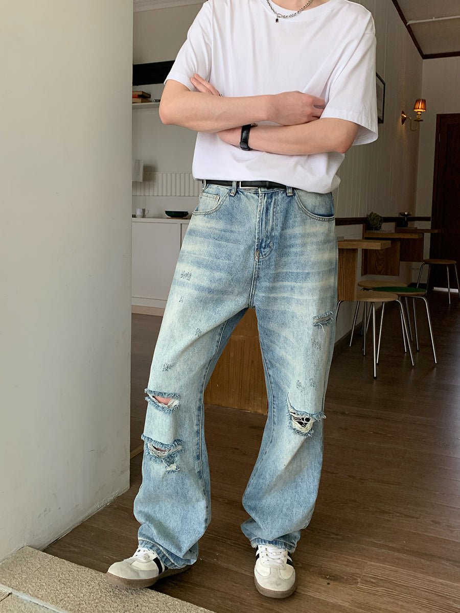 Distressed straight denim pants